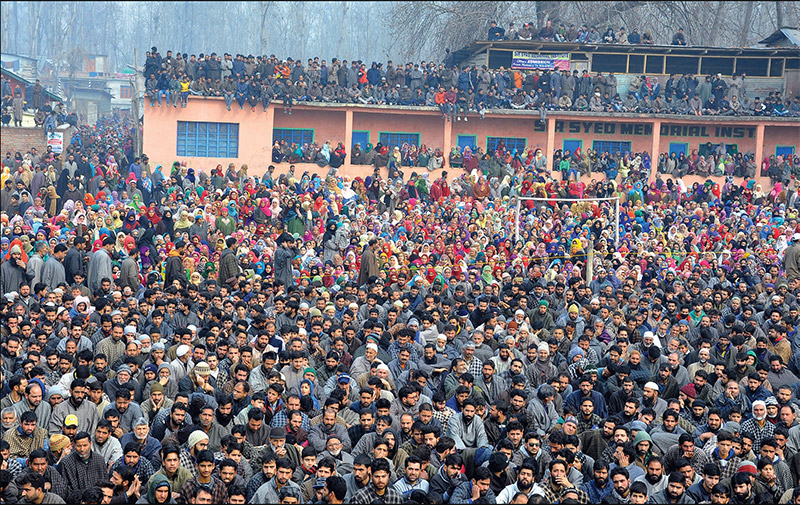 Kashmiri villagers at the funeral prayers of the local militant that gunned down Shujaat Bukhari