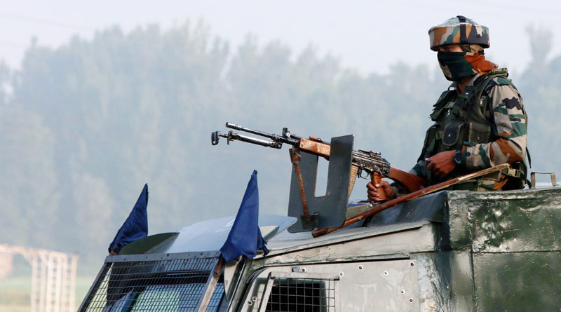 Picture Story: Security Personnel Takes Position in Near an Encounter Sight in Kulgam