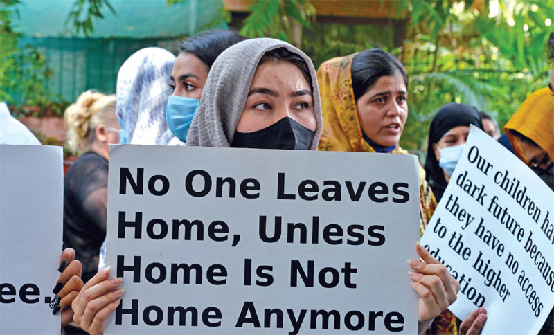 Afghan refugees protesting outside UNHRC in New Delhi