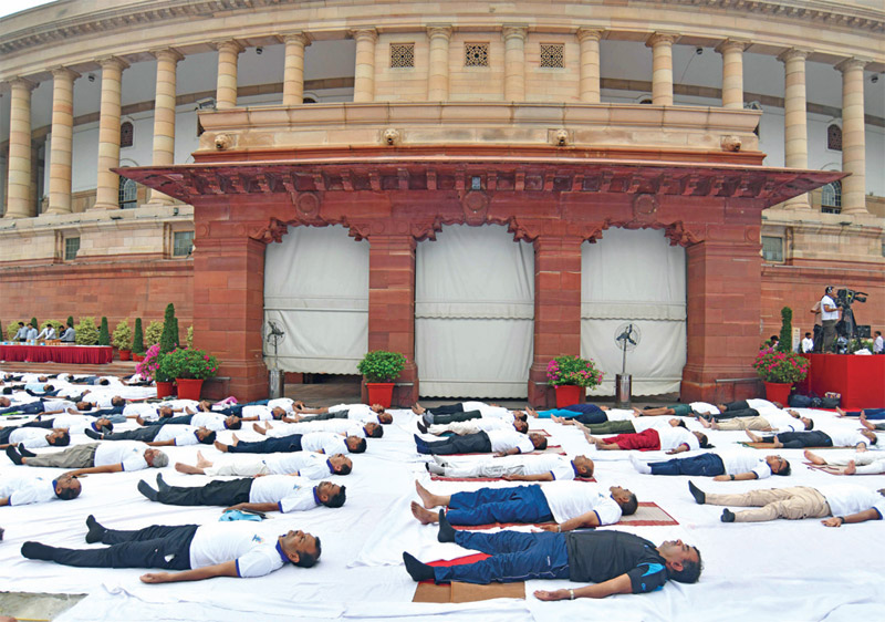 Lok Sabha Speaker Om Birla doing yoga outside the Parliament