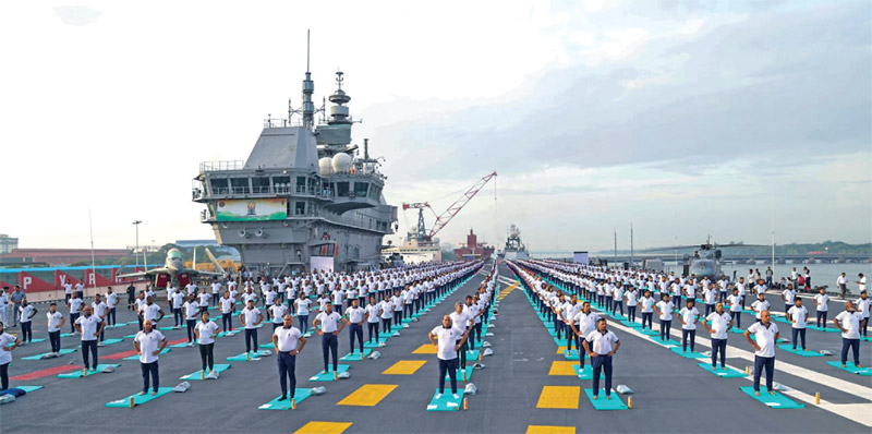 Defence minister leading naval personnel on INS Vikrant