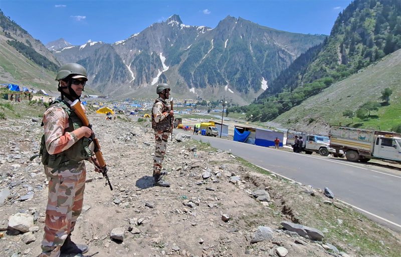 Paramilitary personnel stand guard near the Amarnath Yatra main base camp at Baltal, Sonamarg